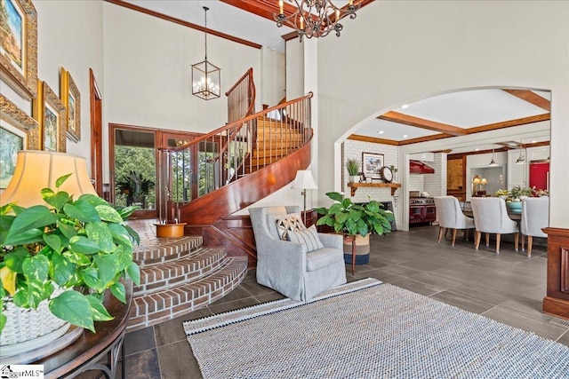 4 Huntington Ct, Greenville, SC 29615 - stairway featuring a chandelier, arched walkways, and a high ceiling