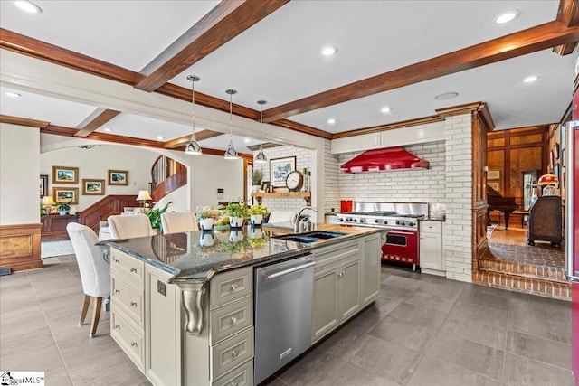 4 Huntington Ct, Greenville, SC 29615 - kitchen featuring appliances with stainless steel finishes, beamed ceiling, ventilation hood, an island with sink, and dark stone countertops