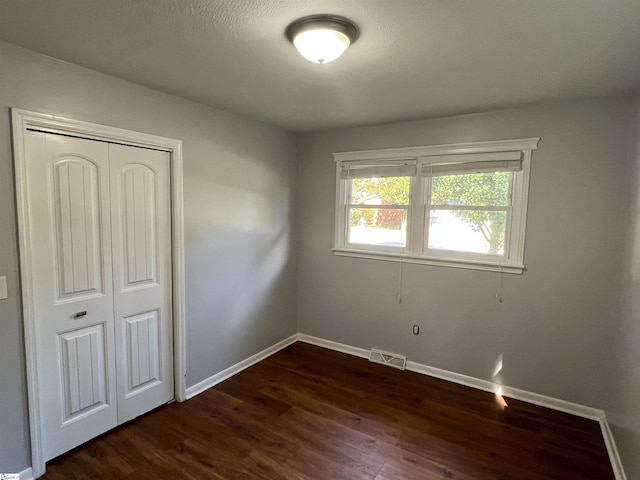 204 Sherondale Ln, Simpsonville, SC 29680 - unfurnished bedroom featuring dark wood-style flooring and a closet