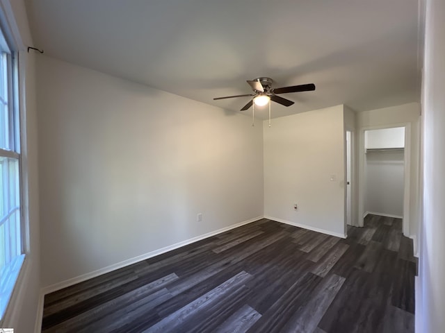 107 Feldman Dr, Easley, SC 29640 - unfurnished bedroom with dark wood-style floors, a ceiling fan, and a closet