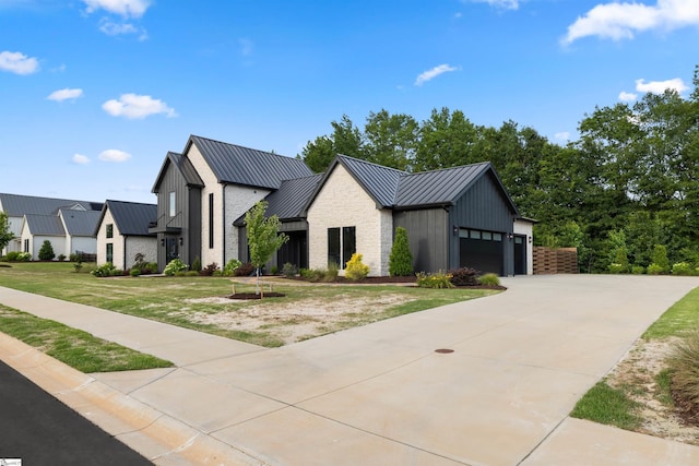 304 Waterford Fall Way, Simpsonville, SC 29681 - modern inspired farmhouse with a standing seam roof, a metal roof, a garage, a front lawn, and concrete driveway