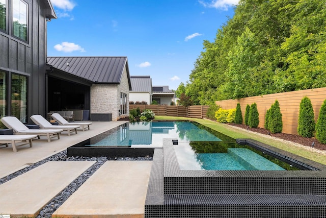 304 Waterford Fall Way, Simpsonville, SC 29681 - view of pool featuring a fenced backyard, a patio, and a pool with connected hot tub