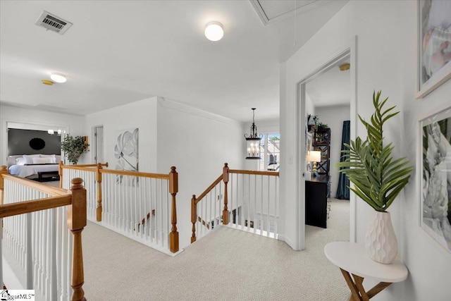 9 Springhead Way, Greer, SC 29650 - hallway with an upstairs landing, attic access, carpet, and ornamental molding