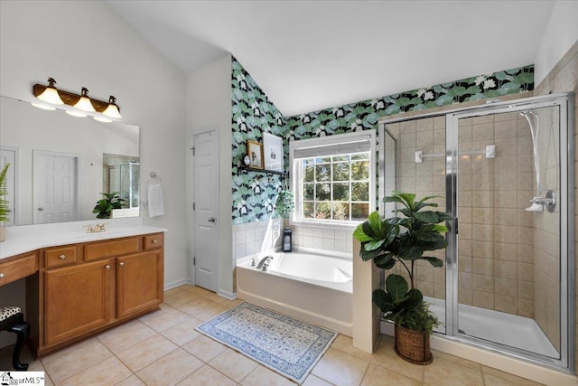 9 Springhead Way, Greer, SC 29650 - bathroom featuring lofted ceiling, vanity, tile patterned floors, a stall shower, and a garden tub