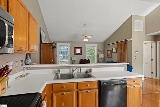 17 Lantern Ln, Greer, SC 29651 - kitchen featuring dishwasher, stainless steel microwave, a peninsula, vaulted ceiling, and light countertops
