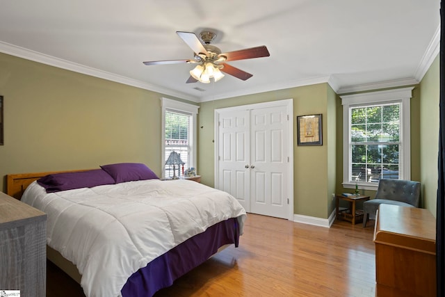 17 Lantern Ln, Greer, SC 29651 - bedroom with multiple windows, light wood finished floors, crown molding, a closet, and ceiling fan