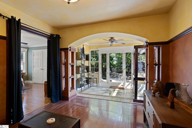 17 Lantern Ln, Greer, SC 29651 - doorway to outside featuring arched walkways, hardwood / wood-style flooring, ceiling fan, and ornamental molding
