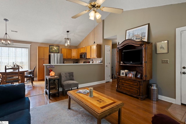 17 Lantern Ln, Greer, SC 29651 - living room with a chandelier, light wood-type flooring, a ceiling fan, and high vaulted ceiling