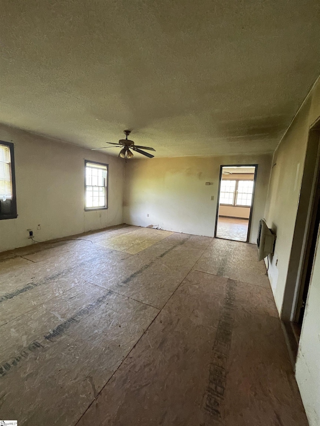 875 Love And Care Rd, Six Mile, SC 29682 - unfurnished room with a ceiling fan and a textured ceiling