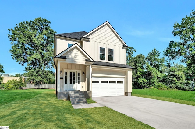 104 Ansel Dr, Clinton, SC 29325 - view of front of home featuring driveway, board and batten siding, an attached garage, and a shingled roof