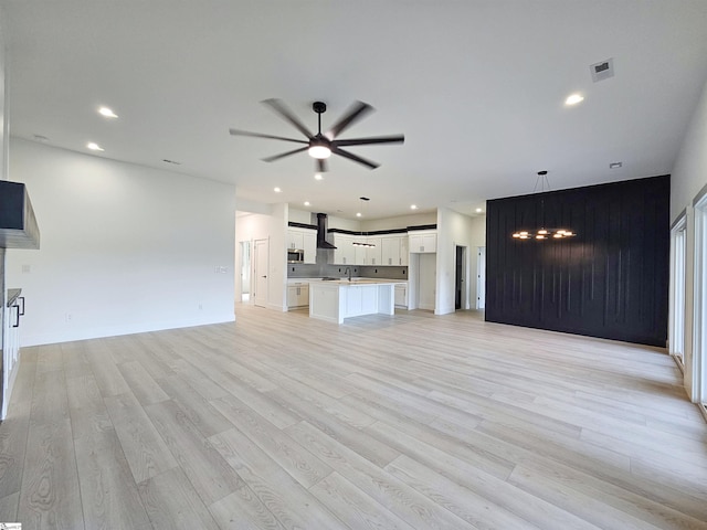 162 Refuge Church Rd, Central, SC 29630 - unfurnished living room with a ceiling fan, light wood finished floors, recessed lighting, and a fireplace