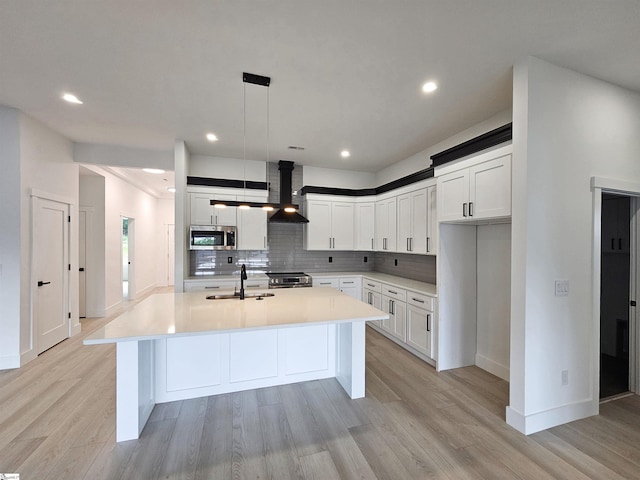 162 Refuge Church Rd, Central, SC 29630 - kitchen featuring stainless steel appliances, a kitchen island with sink, decorative backsplash, light countertops, and recessed lighting