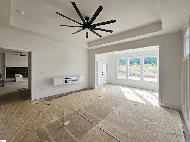 2927 Old Greenville Hwy, Central, SC 29630 - unfurnished living room with a raised ceiling and a ceiling fan