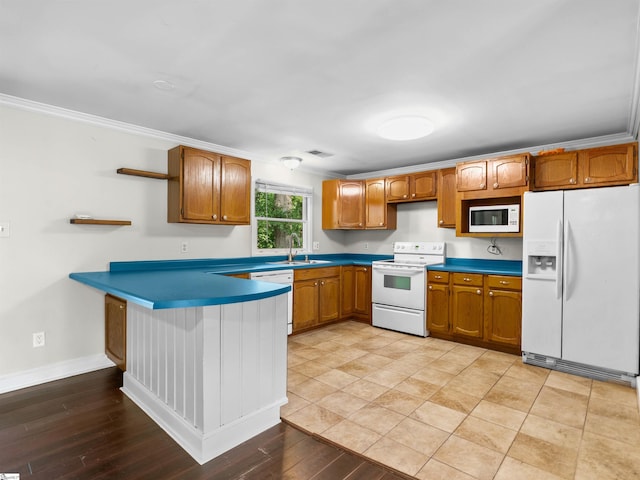 113 Commodore Dr, Duncan, SC 29334 - kitchen with white appliances, open shelves, a peninsula, crown molding, and brown cabinetry