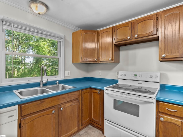 113 Commodore Dr, Duncan, SC 29334 - kitchen with electric stove, brown cabinetry, ornamental molding, light tile patterned floors, and light countertops