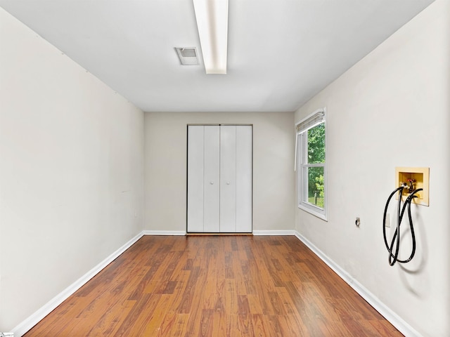 113 Commodore Dr, Duncan, SC 29334 - unfurnished bedroom with wood finished floors and a closet