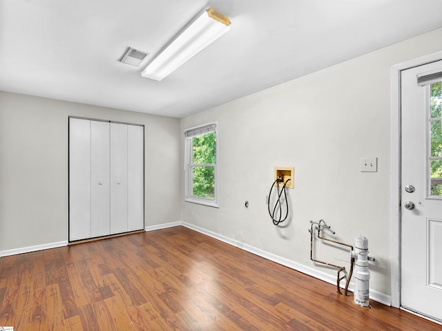 113 Commodore Dr, Duncan, SC 29334 - unfurnished bedroom with multiple windows, wood finished floors, and a closet