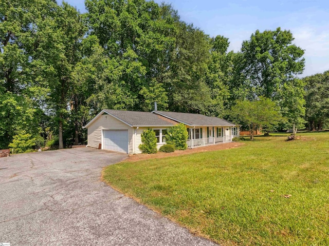 113 Commodore Dr, Duncan, SC 29334 - ranch-style home featuring asphalt driveway, covered porch, a front lawn, and a garage