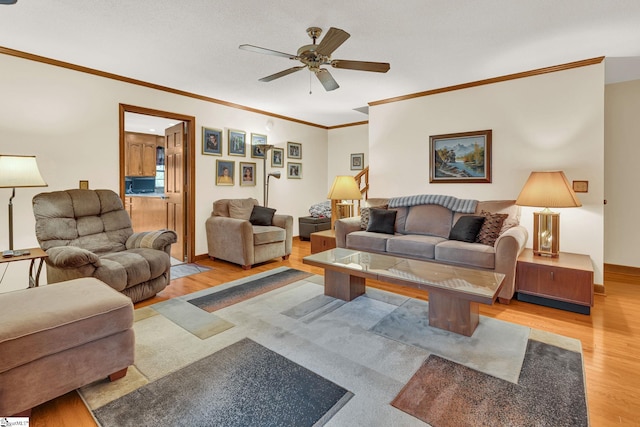 102 Linwood Ct, Simpsonville, SC 29681 - living room featuring light wood-type flooring, a ceiling fan, and crown molding