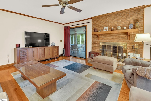 102 Linwood Ct, Simpsonville, SC 29681 - living room featuring a ceiling fan, ornamental molding, wood finished floors, and a brick fireplace