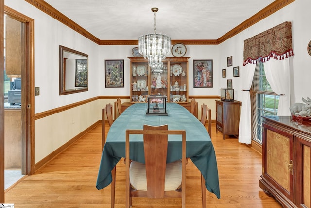 102 Linwood Ct, Simpsonville, SC 29681 - dining room featuring a chandelier, light wood finished floors, and crown molding