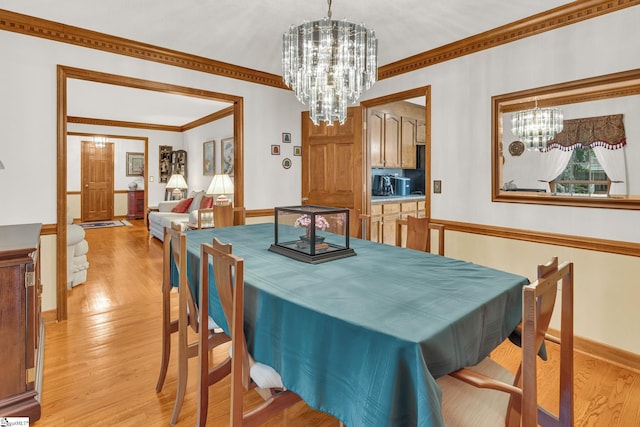 102 Linwood Ct, Simpsonville, SC 29681 - dining space with a chandelier, light wood finished floors, and crown molding