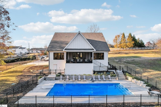 237 Rockcrest Dr, Taylors, SC 29687 - back of property featuring stairs, a community pool, board and batten siding, a shingled roof, and stucco siding