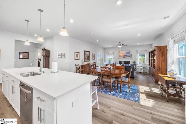 18 Yakama Way, Greenville, SC 29607 - kitchen featuring light wood finished floors, dishwasher, a ceiling fan, white cabinetry, and recessed lighting