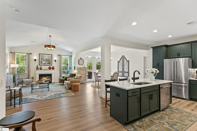 240 Nicole Marie Ct, Greer, SC 29651 - kitchen featuring green cabinets, appliances with stainless steel finishes, light countertops, light wood-type flooring, and open floor plan