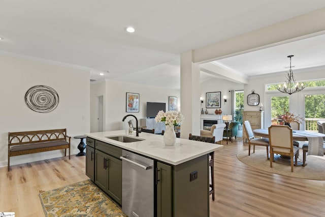 240 Nicole Marie Ct, Greer, SC 29651 - kitchen with stainless steel dishwasher, open floor plan, light wood-style floors, light countertops, and crown molding