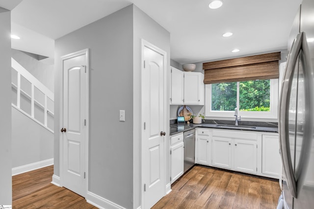 150 Stallings Rd Unit A1, Taylors, SC 19687 - kitchen featuring stainless steel appliances, dark countertops, white cabinets, dark wood finished floors, and recessed lighting
