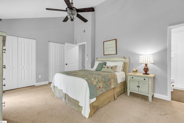 150 Stallings Rd Unit A1, Taylors, SC 19687 - bedroom with high vaulted ceiling, two closets, light carpet, ensuite bathroom, and ceiling fan