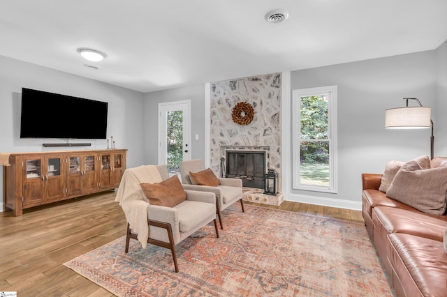 150 Stallings Rd Unit A1, Taylors, SC 19687 - living room featuring plenty of natural light, light wood-style floors, and a high end fireplace