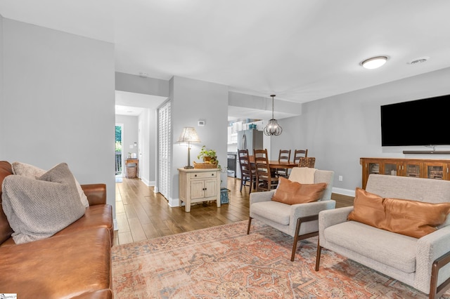 150 Stallings Rd Unit A1, Taylors, SC 19687 - living area featuring wood finished floors and a chandelier