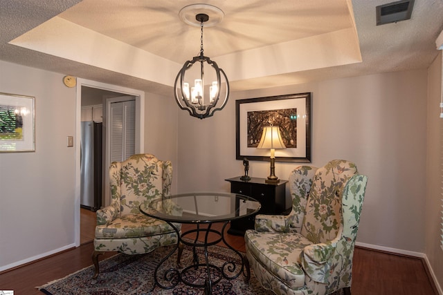 130 Inglewood Way, Greenville, SC 29615 - sitting room featuring a chandelier, wood finished floors, and a raised ceiling