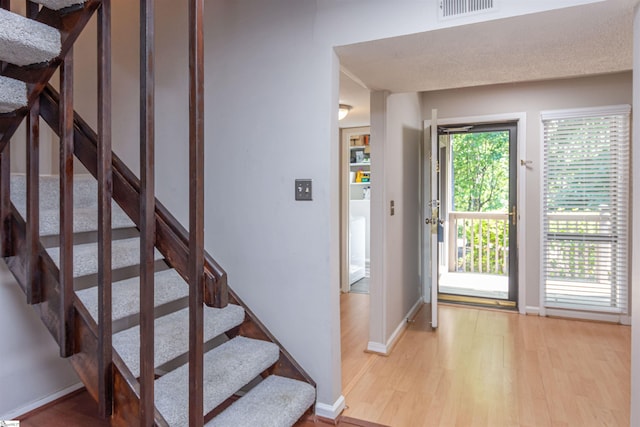 130 Inglewood Way, Greenville, SC 29615 - foyer with wood finished floors and stairs