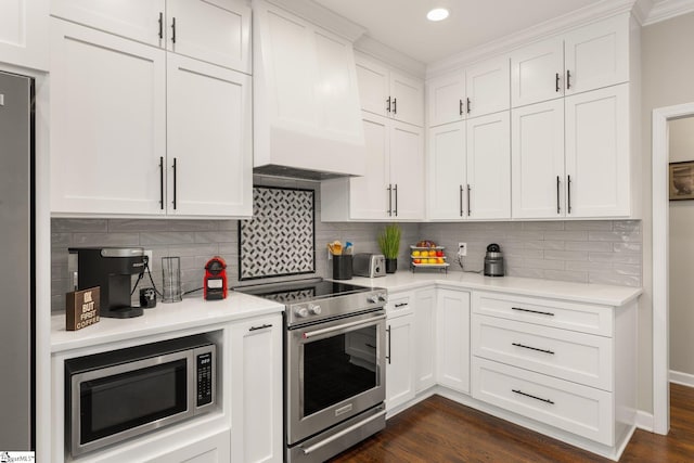 6 Nakkol Dr, Simpsonville, SC 29680 - kitchen with appliances with stainless steel finishes, light countertops, custom range hood, white cabinetry, and recessed lighting