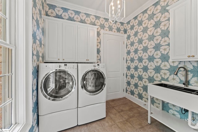 19 Hobcaw Dr, Greer, SC 29650 - laundry room with wallpapered walls, washer and clothes dryer, cabinet space, ornamental molding, and a chandelier