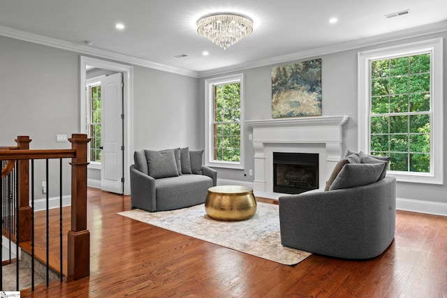 19 Hobcaw Dr, Greer, SC 29650 - living room featuring wood finished floors, a fireplace, a chandelier, ornamental molding, and recessed lighting