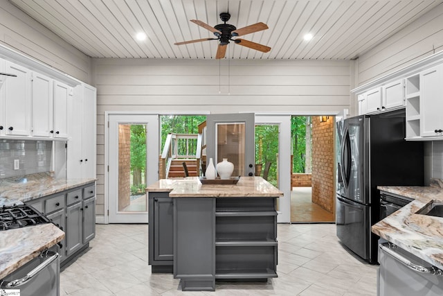 19 Hobcaw Dr, Greer, SC 29650 - kitchen with open shelves, gray cabinets, ceiling fan, a kitchen island, and white cabinets