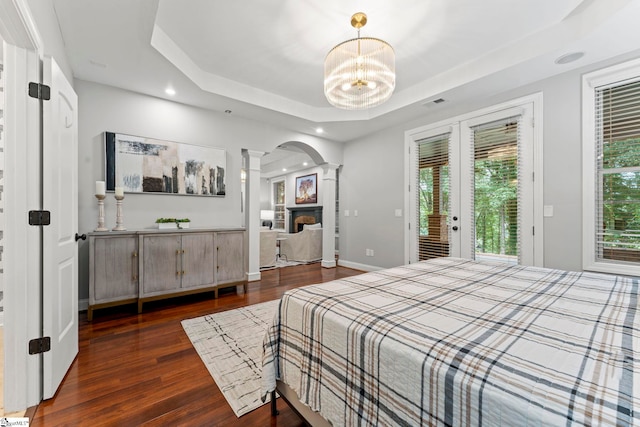 19 Hobcaw Dr, Greer, SC 29650 - bedroom featuring ornate columns, access to exterior, a raised ceiling, wood finished floors, and recessed lighting