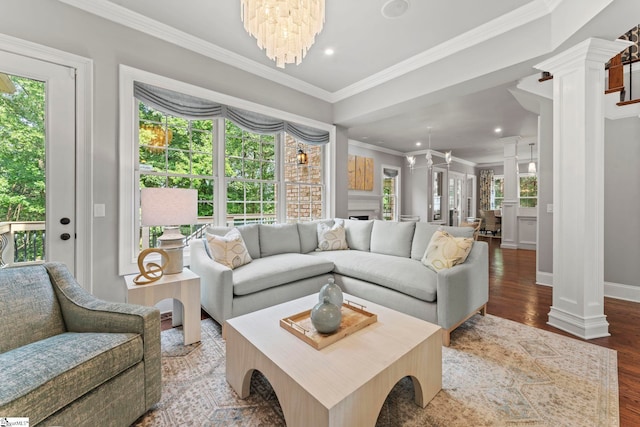 19 Hobcaw Dr, Greer, SC 29650 - living room with decorative columns, ornamental molding, wood finished floors, a chandelier, and recessed lighting