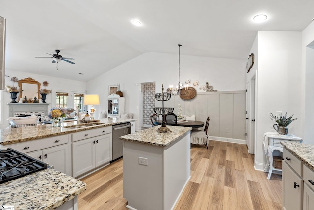 201 Evansdale Way, Simpsonville, SC 29680 - kitchen with dishwasher, a ceiling fan, light wood finished floors, vaulted ceiling, and light stone counters