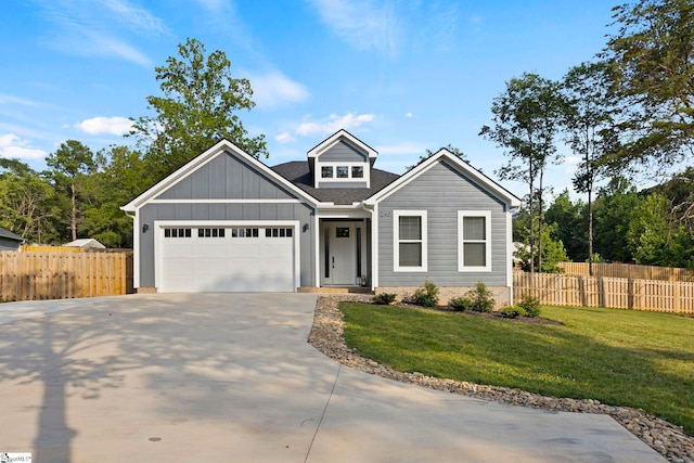 240 E Darby Rd, Taylors, SC 29687 - view of front of home with driveway, board and batten siding, and an attached garage