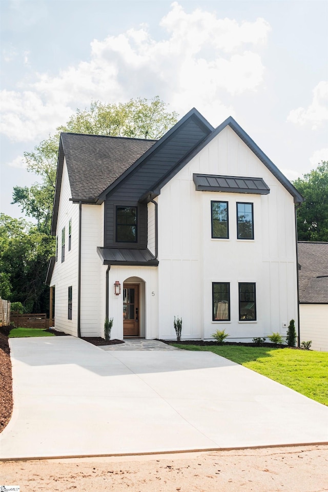 5 Martin Row, Greenville, SC 29601 - modern inspired farmhouse featuring a standing seam roof, board and batten siding, a metal roof, driveway, and roof with shingles
