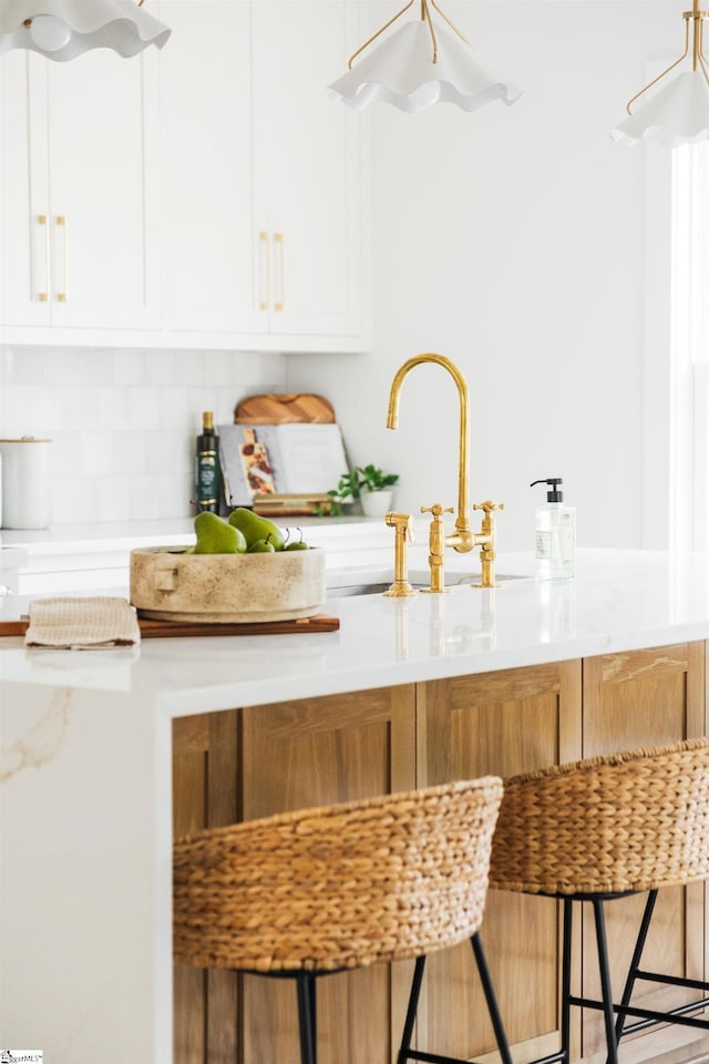 5 Martin Row, Greenville, SC 29601 - kitchen featuring decorative backsplash, light countertops, and white cabinetry