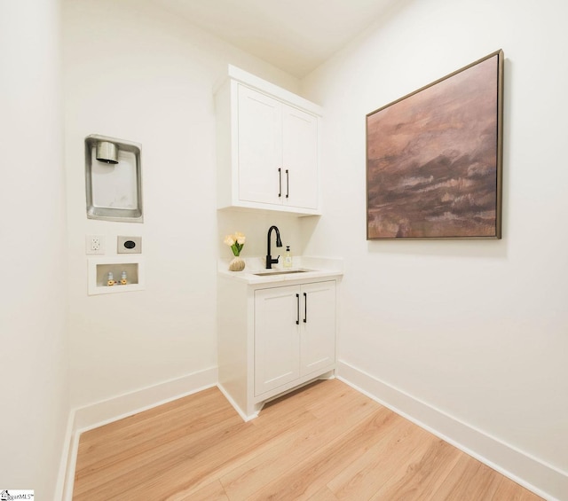 5 Martin Row, Greenville, SC 29601 - washroom featuring hookup for an electric dryer, light wood-style flooring, hookup for a washing machine, and cabinet space
