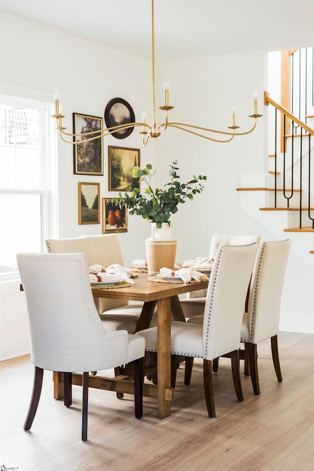 5 Martin Row, Greenville, SC 29601 - dining room featuring light wood-style flooring, stairs, and a chandelier