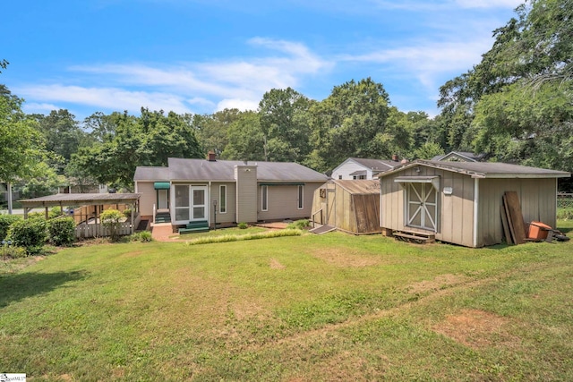 19 E Circle Ave, Greenville, SC 29607 - rear view of house featuring a shed, a lawn, entry steps, and a chimney