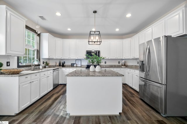 409 Summergreen Way, Greenville, SC 29607 - kitchen featuring stainless steel appliances, white cabinets, a center island, dark wood-style floors, and recessed lighting